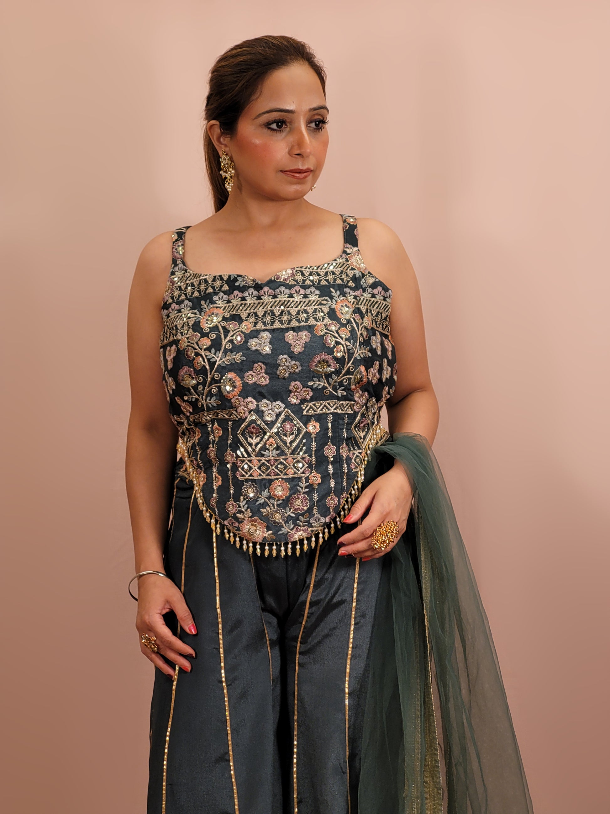 Elevate your ethnic wardrobe with this exquisite Cadet Blue Indo-Western Palazzo Dress. This stunning ensemble is perfect for any fashion-forward woman looking to make an impression at weddings, parties, or festive occasions.