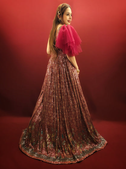 Draped in a magenta sequins gown, adorned with glass beads, crafted from the finest imported fabric, be the epitome of elegance at engagement party, truly the best-dressed bride-to-be.