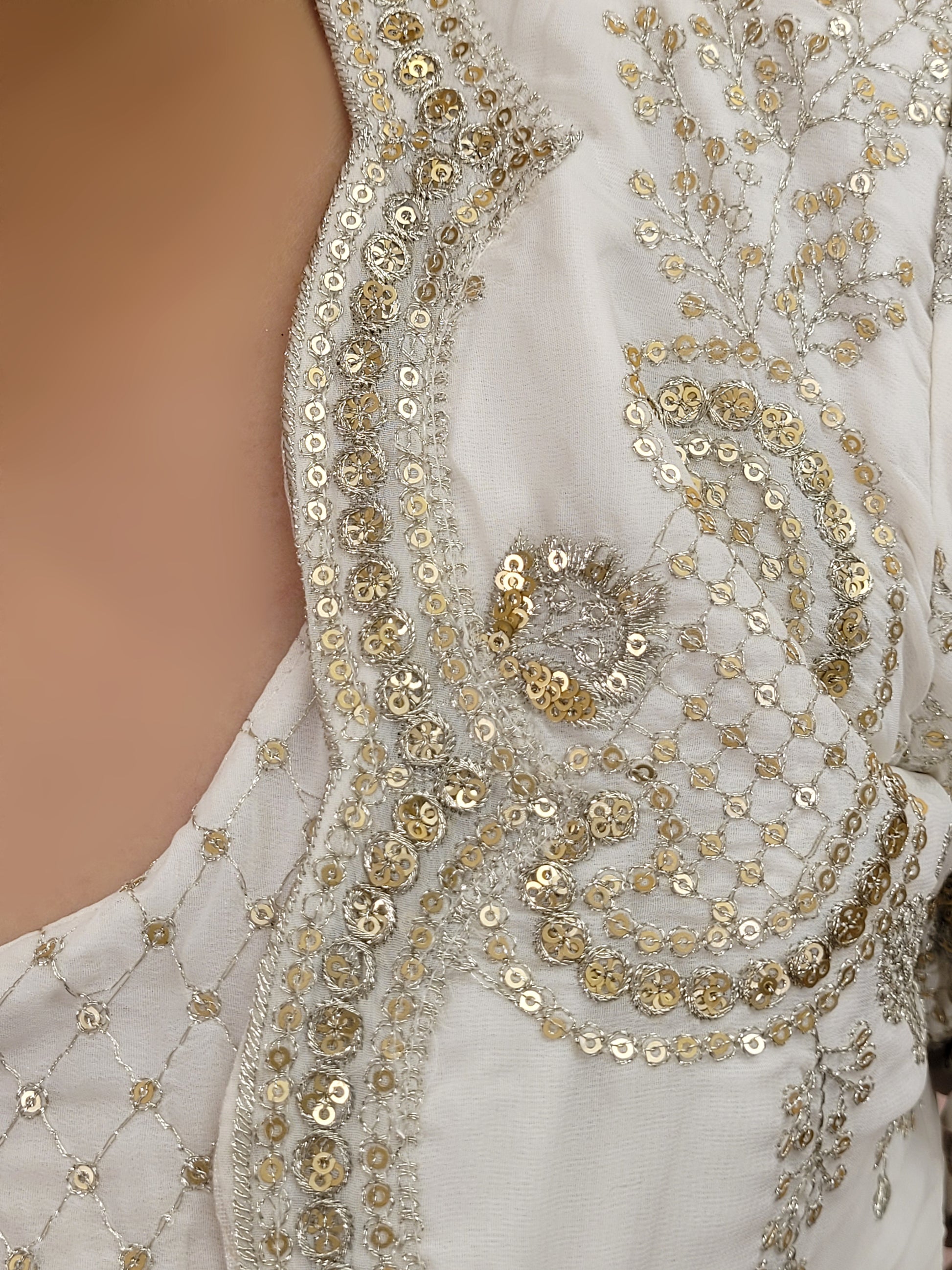 Madhuri Dixit look inspired White Indo Western Set Zari and Sequins work on top pants and shrug. Inspired by designer Nupur Kanoi's look showcased by Madhuri Dixit.