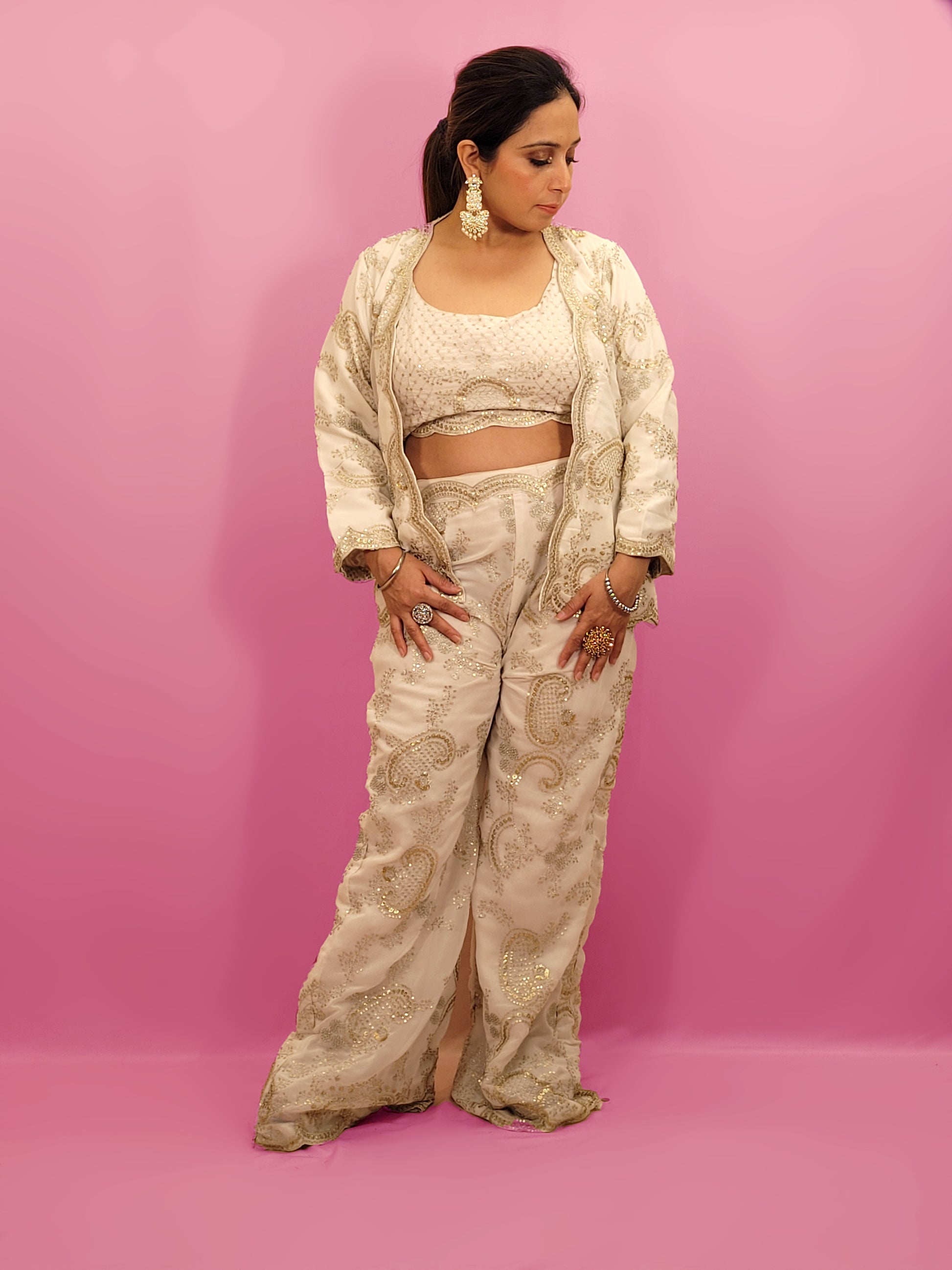 Madhuri Dixit look inspired White Indo Western Set Zari and Sequins work on top pants and shrug. Inspired by designer Nupur Kanoi's look showcased by Madhuri Dixit.