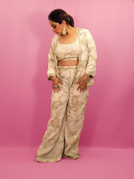 Madhuri Dixit look inspired White Indo Western Set Zari and Sequins work on top pants and shrug. Inspired by designer Nupur Kanoi's look showcased by Madhuri Dixit.
