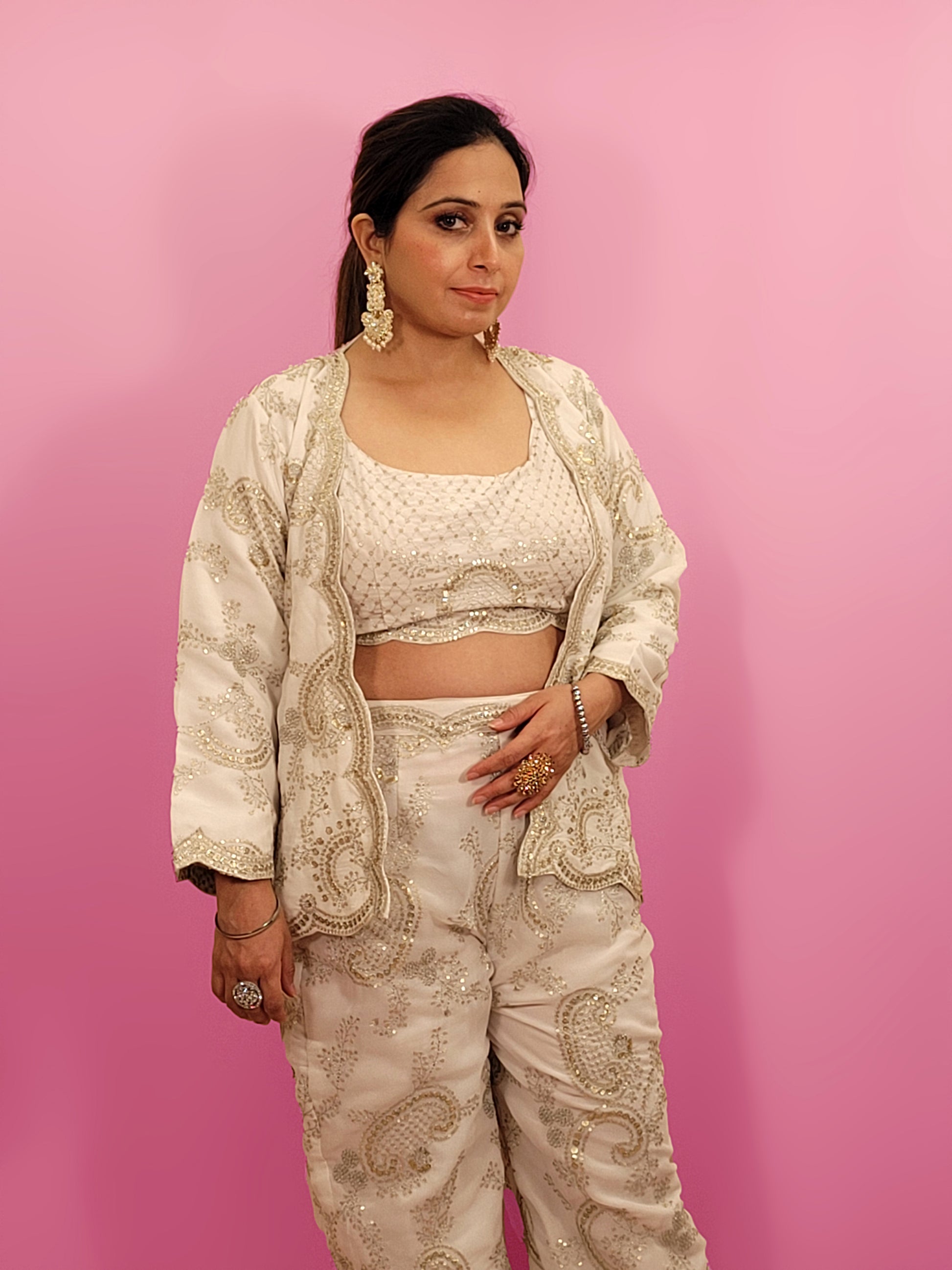 Madhuri Dixit look inspired White Indo Western Set Zari and Sequins work on top pants and shrug. Inspired by designer Nupur Kanoi's look showcased by Madhuri Dixit.