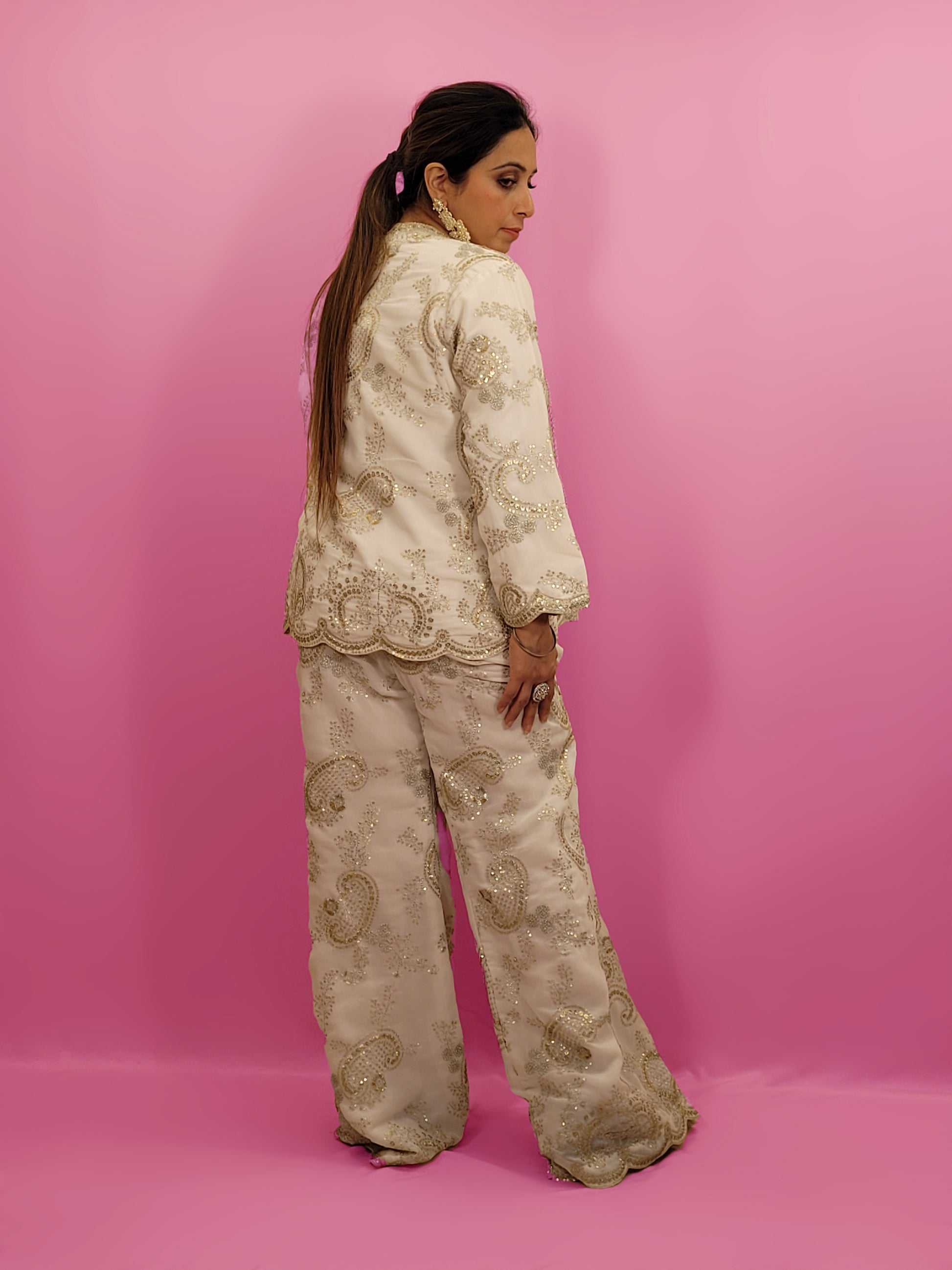 Madhuri Dixit look inspired White Indo Western Set Zari and Sequins work on top pants and shrug. Inspired by designer Nupur Kanoi's look showcased by Madhuri Dixit.