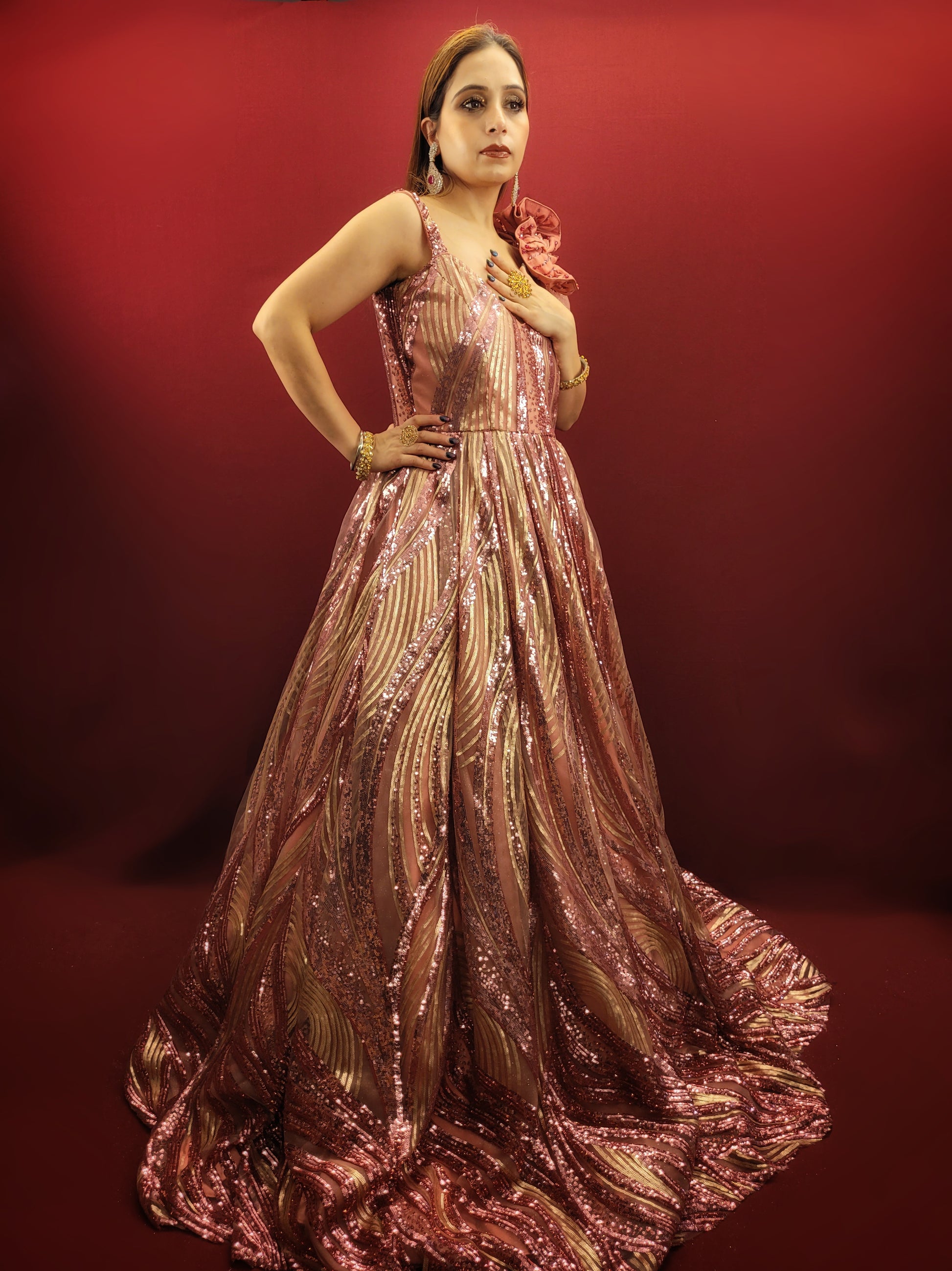 Step into your fairytale with our imported Gajri Pink Bridal Gown, adorned with sequins, beads and crystal flower on the shoulder, perfect for your engagement, cocktail or wedding day.