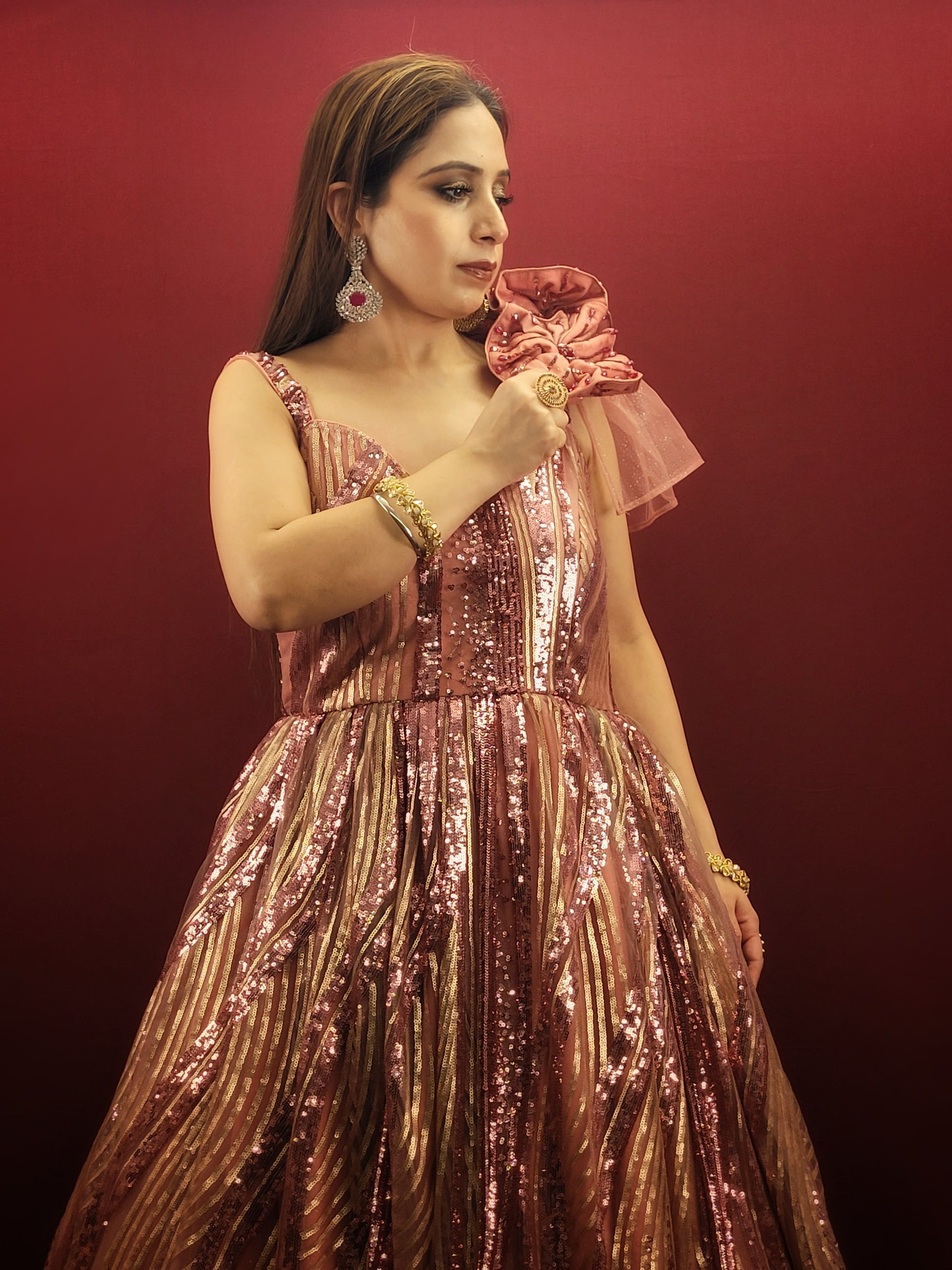 Step into your fairytale with our imported Gajri Pink Bridal Gown, adorned with sequins, beads and crystal flower on the shoulder, perfect for your engagement, cocktail or wedding day.