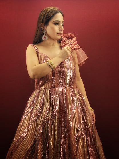 Step into your fairytale with our imported Gajri Pink Bridal Gown, adorned with sequins, beads and crystal flower on the shoulder, perfect for your engagement, cocktail or wedding day.