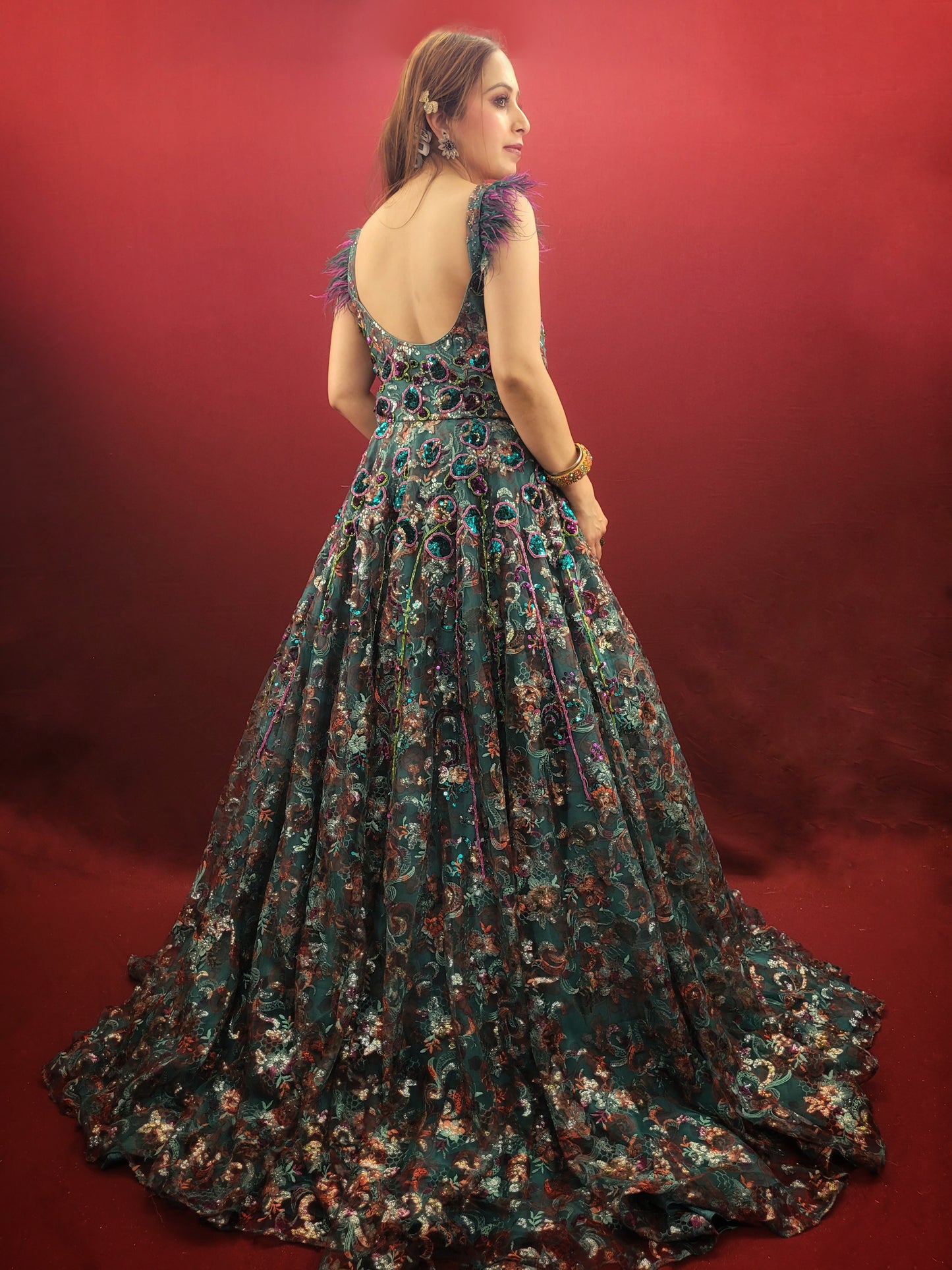 Elevate your special occasions with our Rama Green Cocktail Gown, featuring a lavish display of beads and sequins on imported fabric, ideal for engagement and reception celebrations.