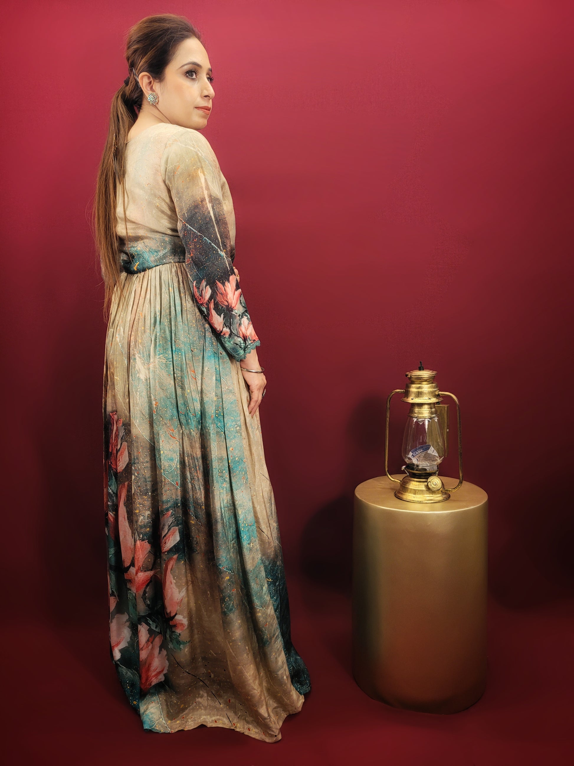 A captivating digital print in a kaleidoscope of colors turns heads wherever you go. The muslin fabric drapes beautifully, ensuring a comfortable and flattering fit. The fusion silhouette offers a unique twist on traditional Indian gowns, making it perfect for the fashion-forward woman.