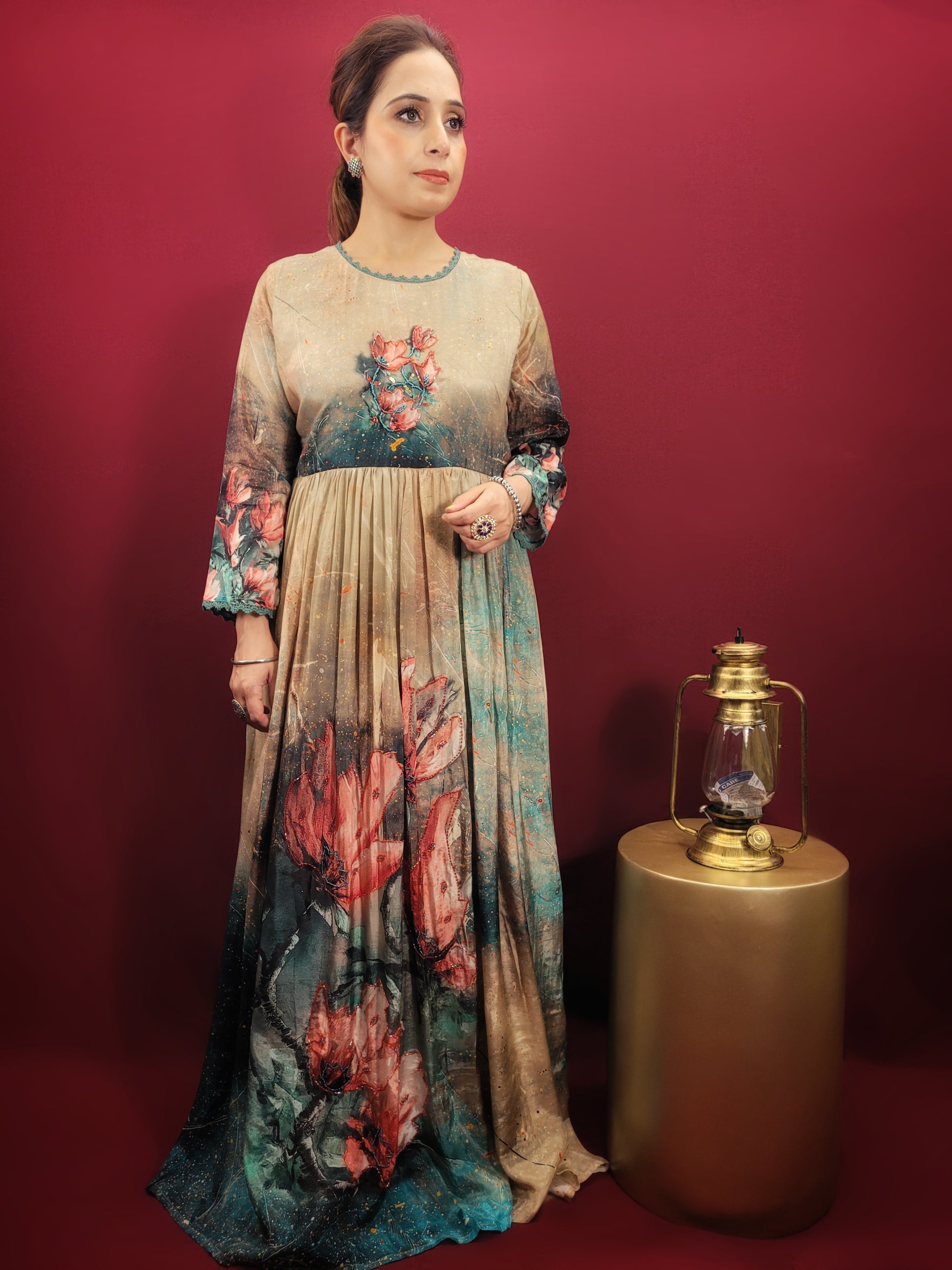 A captivating digital print in a kaleidoscope of colors turns heads wherever you go. The muslin fabric drapes beautifully, ensuring a comfortable and flattering fit. The fusion silhouette offers a unique twist on traditional Indian gowns, making it perfect for the fashion-forward woman.