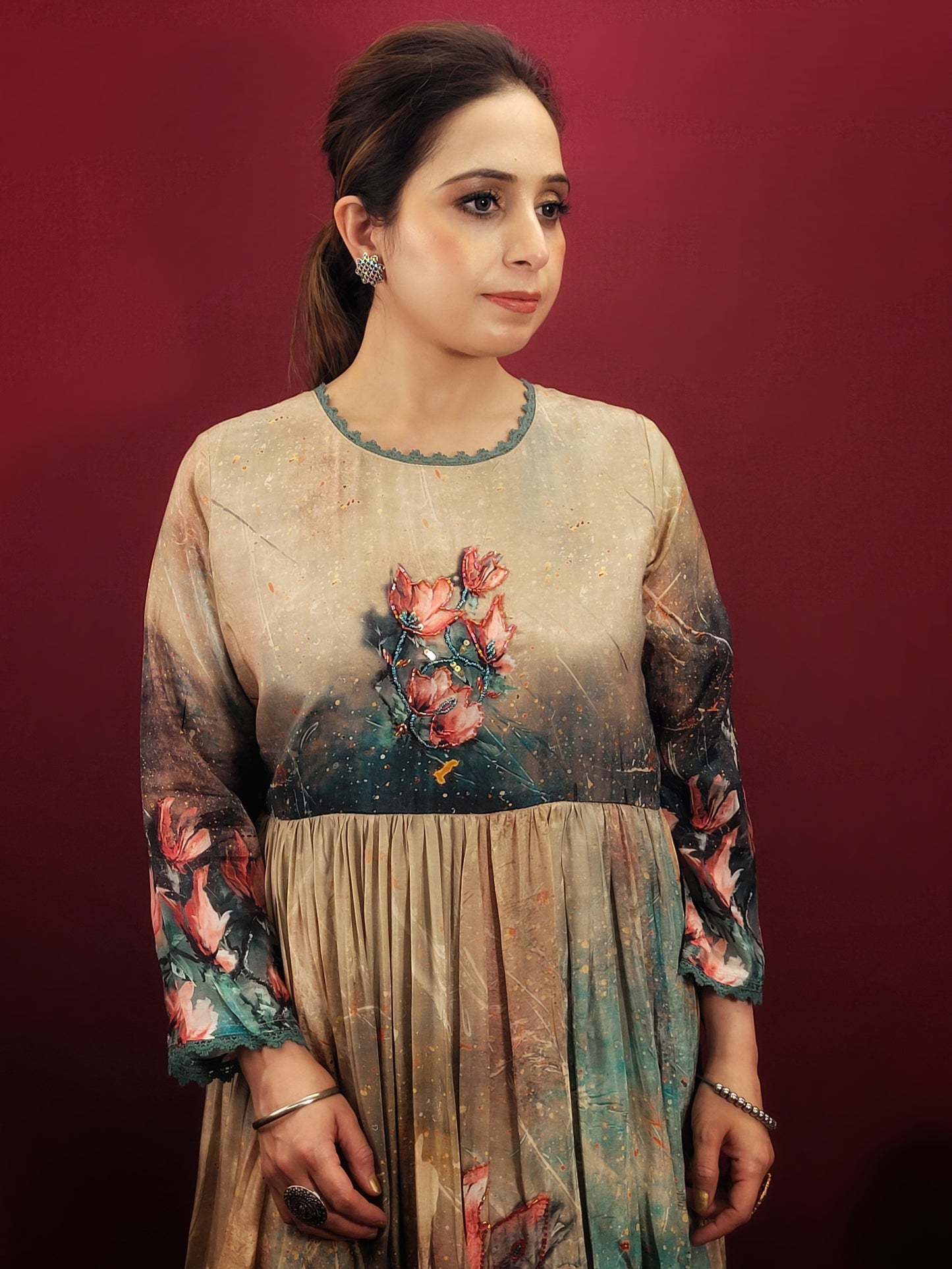 A captivating digital print in a kaleidoscope of colors turns heads wherever you go. The muslin fabric drapes beautifully, ensuring a comfortable and flattering fit. The fusion silhouette offers a unique twist on traditional Indian gowns, making it perfect for the fashion-forward woman.