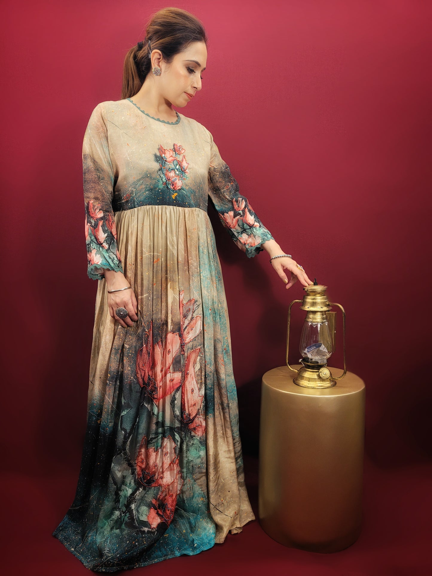 A captivating digital print in a kaleidoscope of colors turns heads wherever you go. The muslin fabric drapes beautifully, ensuring a comfortable and flattering fit. The fusion silhouette offers a unique twist on traditional Indian gowns, making it perfect for the fashion-forward woman.