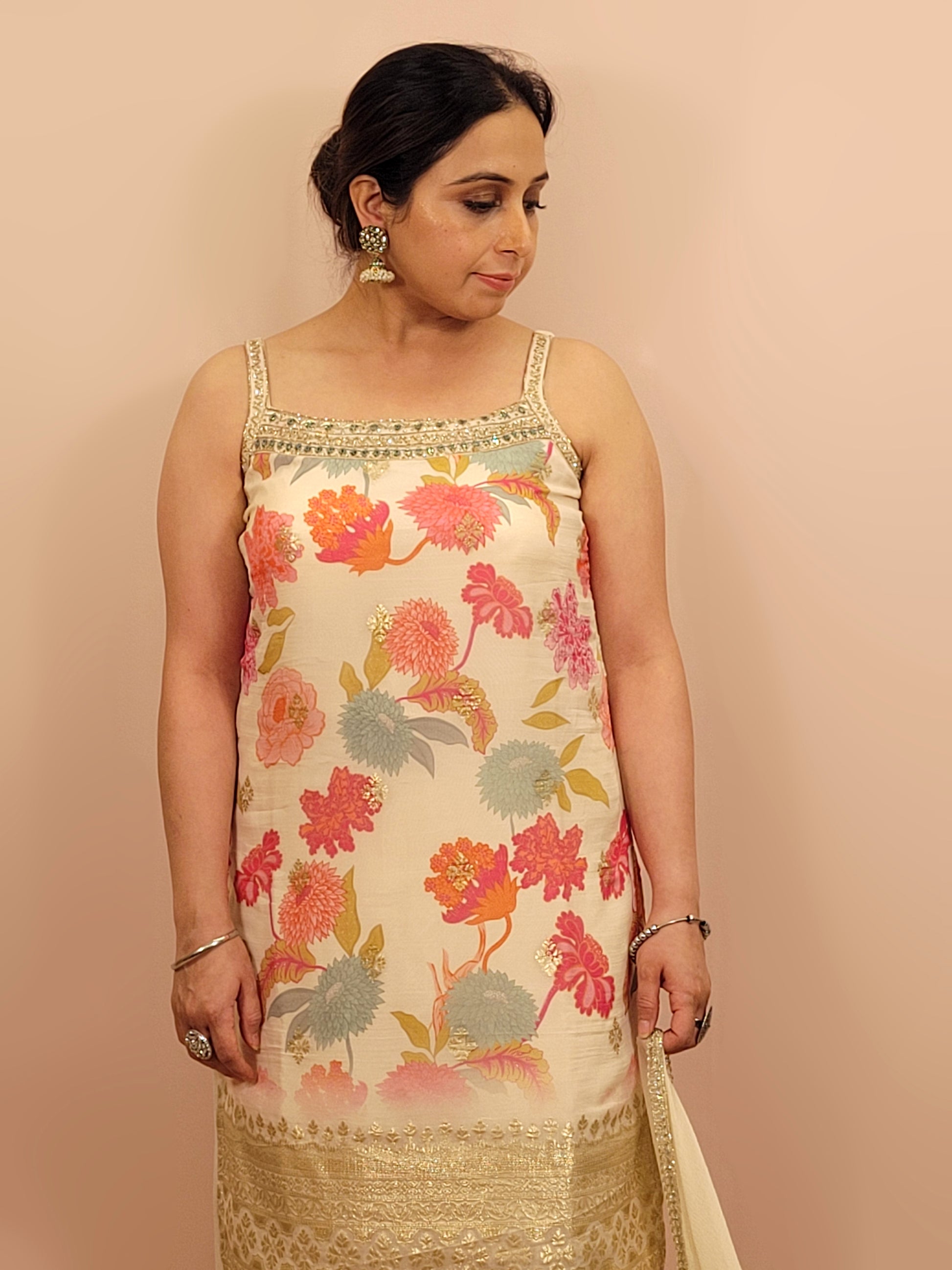 Creme chinon floral print kurti palazzo set. Cutdana, zarkan and dabka work.
