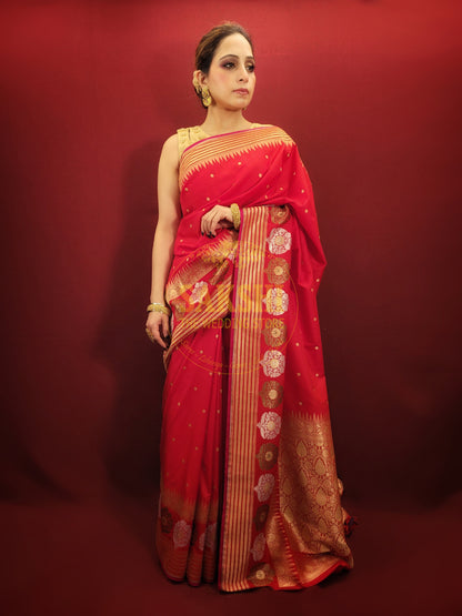 A lightweight banarsi saree in radiant red, perfect for reception and party wear, is a beautiful addition to a woman's ethnic wardrobe.