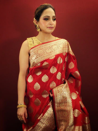 A red banarsi saree, with its zari woven splendor, is a quintessential wedding and party attire, epitomizing the richness of women's ethnic wear.