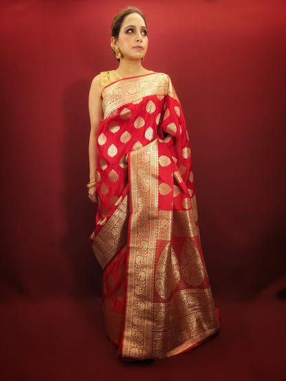 A red banarsi saree, with its zari woven splendor, is a quintessential wedding and party attire, epitomizing the richness of women's ethnic wear.