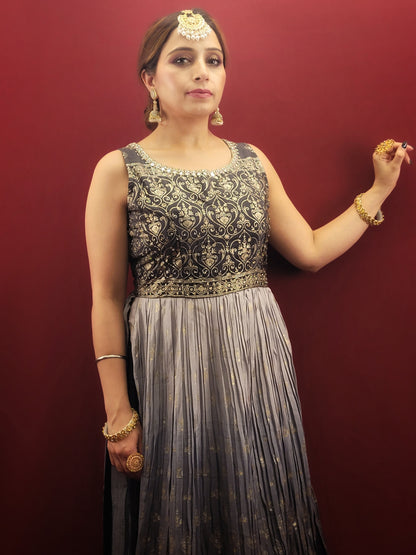 The Nayra suit, with its graceful grey ombre setting and chic Pant Set, is accentuated with traditional block prints and sparkling zarkan, crafted from flowing chinnon, making it a sophisticated ethnic ensemble  for women's party wear.