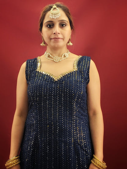 Radiate sophistication with a Prussian blue gharara kameez, featuring elegant thread and sequins embroidery on georgette fabric, an ethnic dress that's a showstopper for party and festive wear.