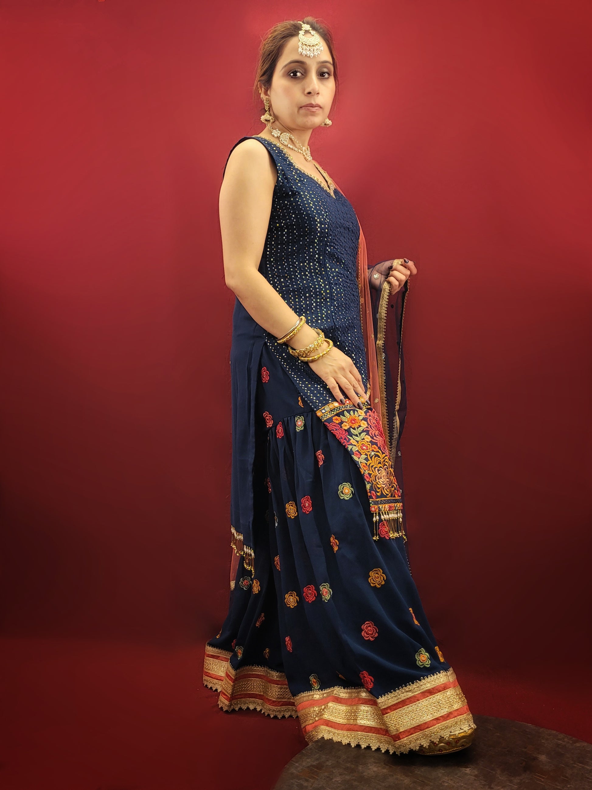 Radiate sophistication with a Prussian blue gharara kameez, featuring elegant thread and sequins embroidery on georgette fabric, an ethnic dress that's a showstopper for party and festive wear.