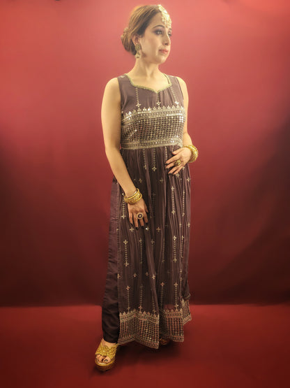 Step into a world of traditional charm with an antique fuchsia Nayra Kameez Pant Set, featuring a sparkle of sequins work, perfect for any ethnic fusion wardrobe.