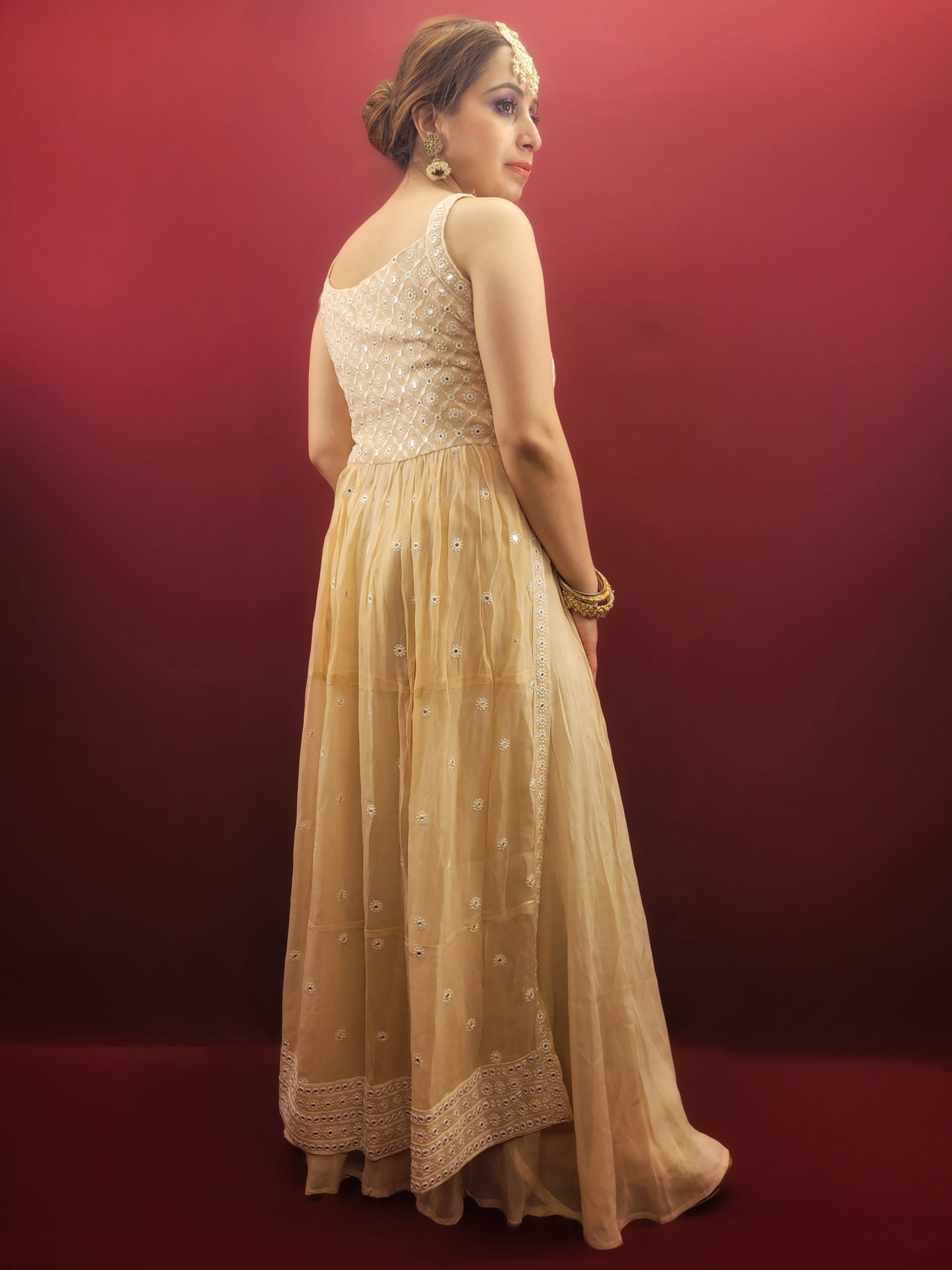 Discover the grace of light peach in this Nayra Kameez Palazzo Set, crafted with delicate chikan threadwork on georgette, an ideal ensemble for party and festive occasions.