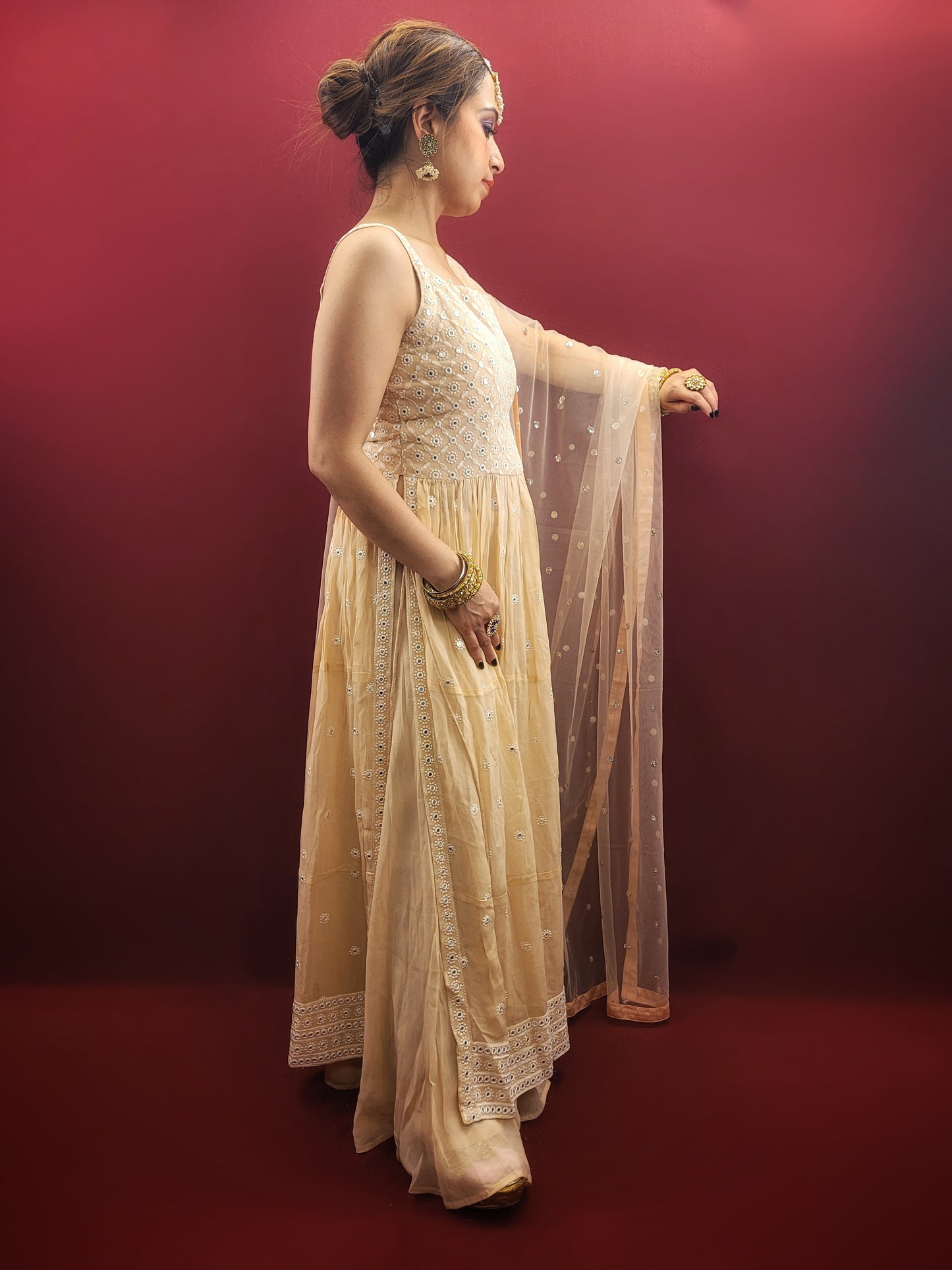 Discover the grace of light peach in this Nayra Kameez Palazzo Set, crafted with delicate chikan threadwork on georgette, an ideal ensemble for party and festive occasions.