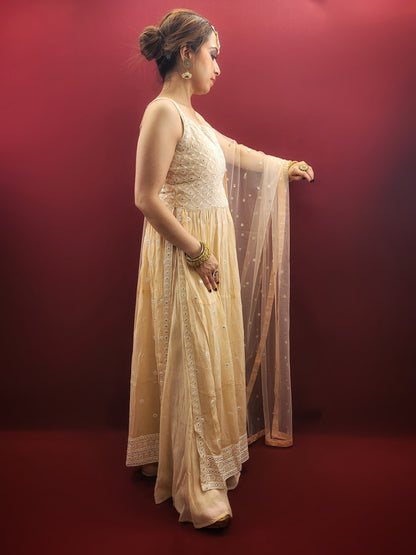 Discover the grace of light peach in this Nayra Kameez Palazzo Set, crafted with delicate chikan threadwork on georgette, an ideal ensemble for party and festive occasions.