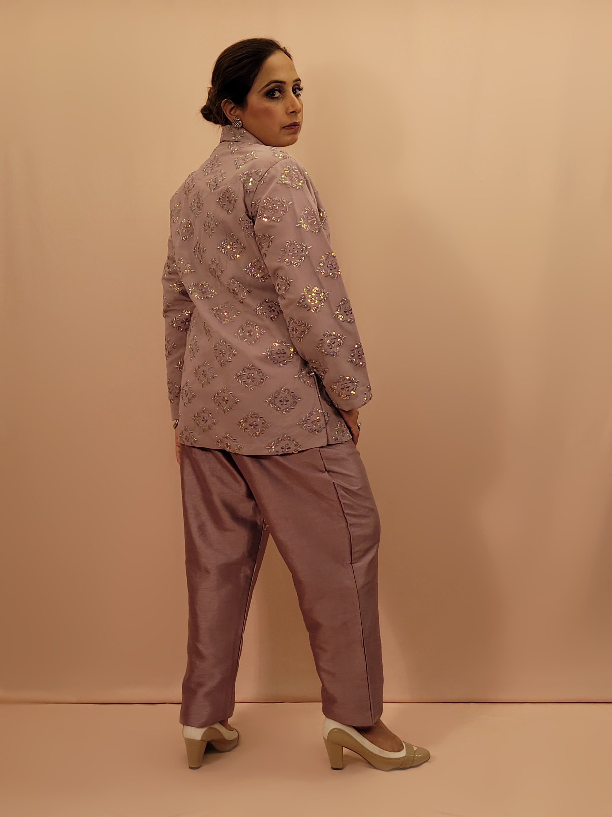 Light Onion Fusion Indo-western Dress.

Contains Silk top and matching Pants.

Matching embroidered Shrug with Resham work and Sequins.

Sophisticated party look.