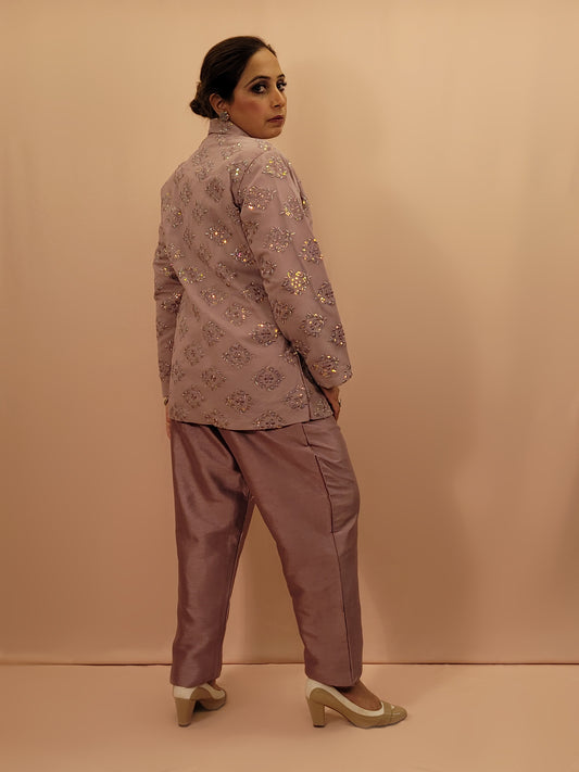 Light Onion Fusion Indo-western Dress.

Contains Silk top and matching Pants.

Matching embroidered Shrug with Resham work and Sequins.

Sophisticated party look.