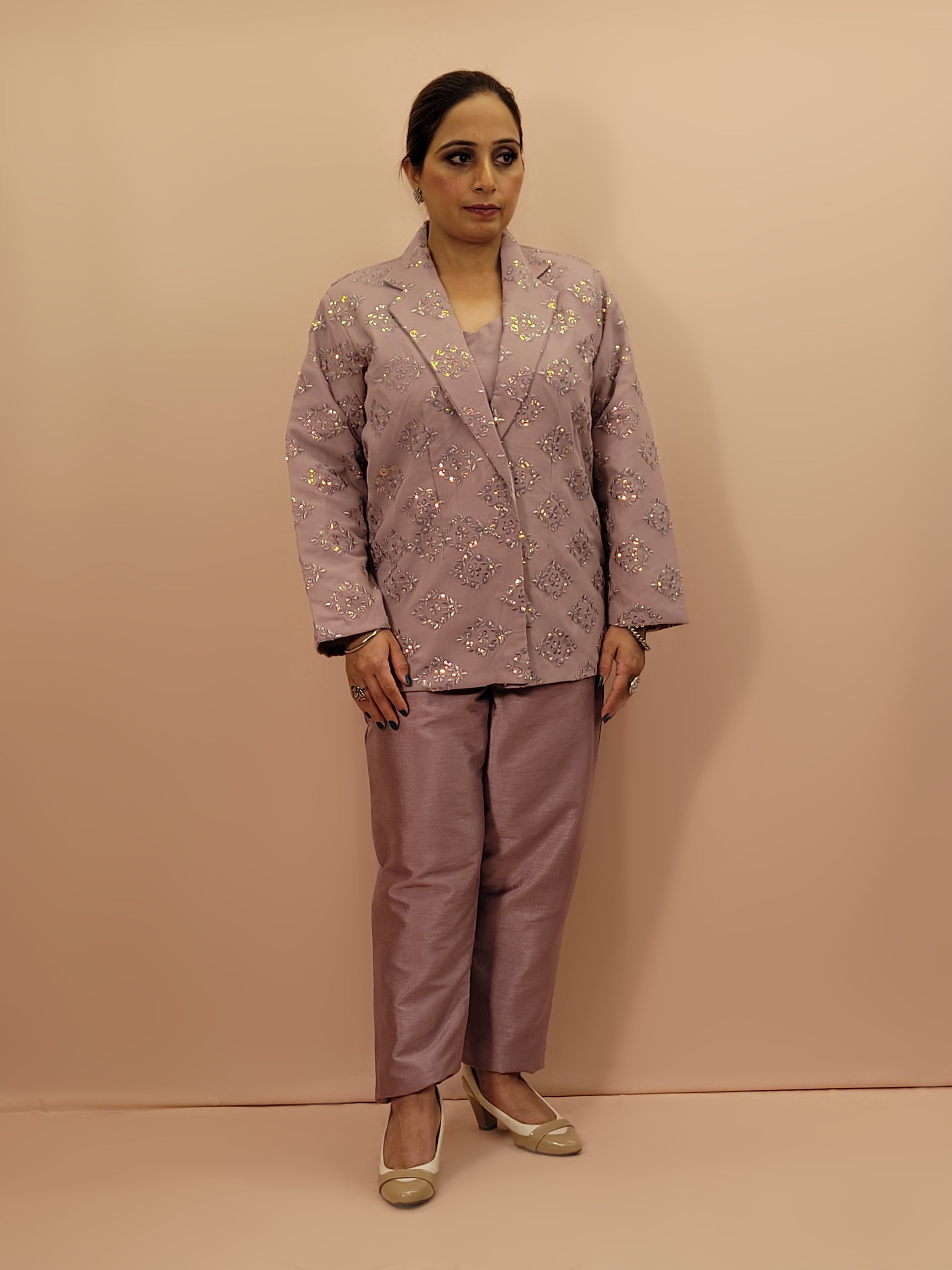 Light Onion Fusion Indo-western Dress.

Contains Silk top and matching Pants.

Matching embroidered Shrug with Resham work and Sequins.

Sophisticated party look.