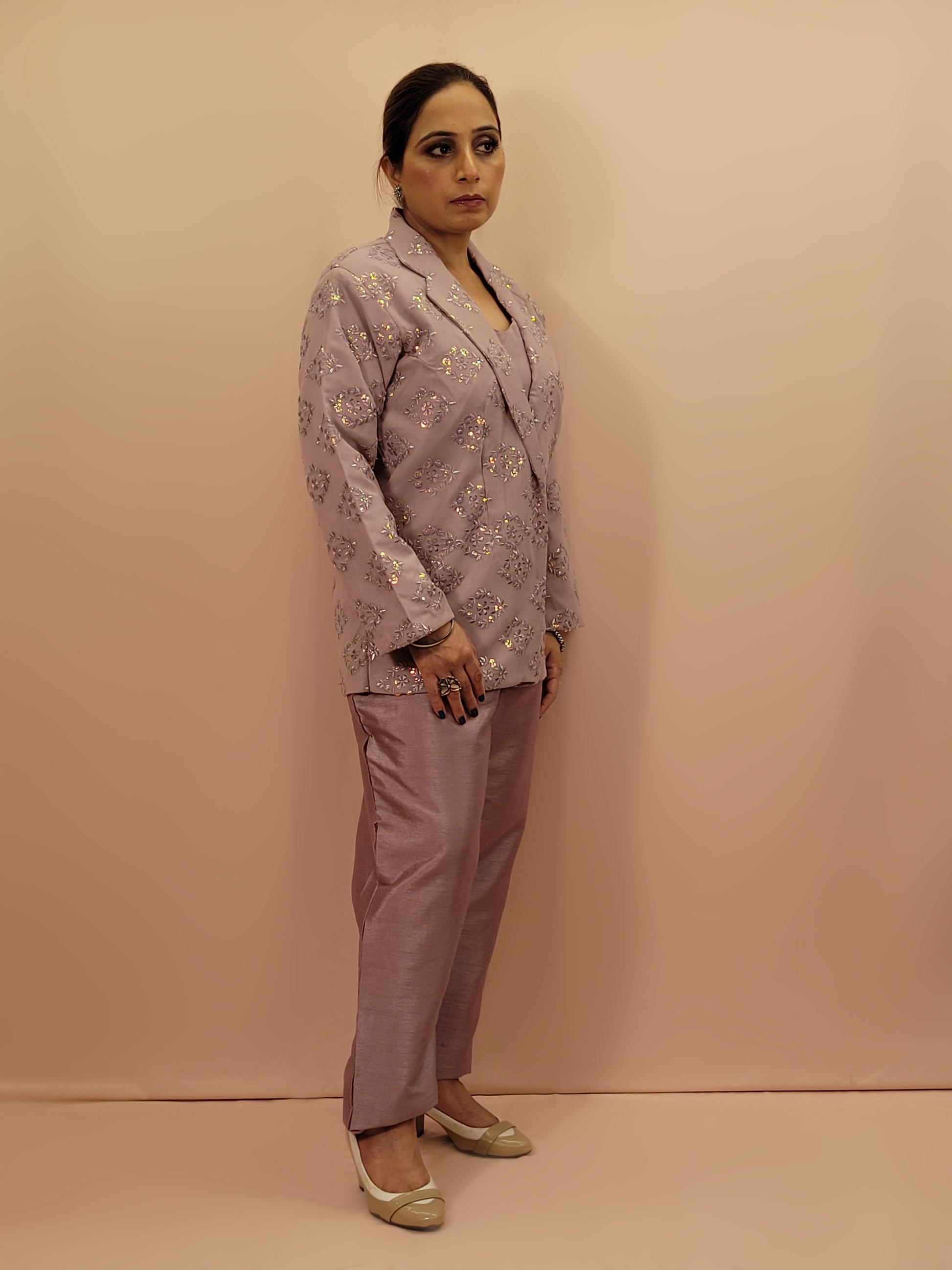 Light Onion Fusion Indo-western Dress.

Contains Silk top and matching Pants.

Matching embroidered Shrug with Resham work and Sequins.

Sophisticated party look.