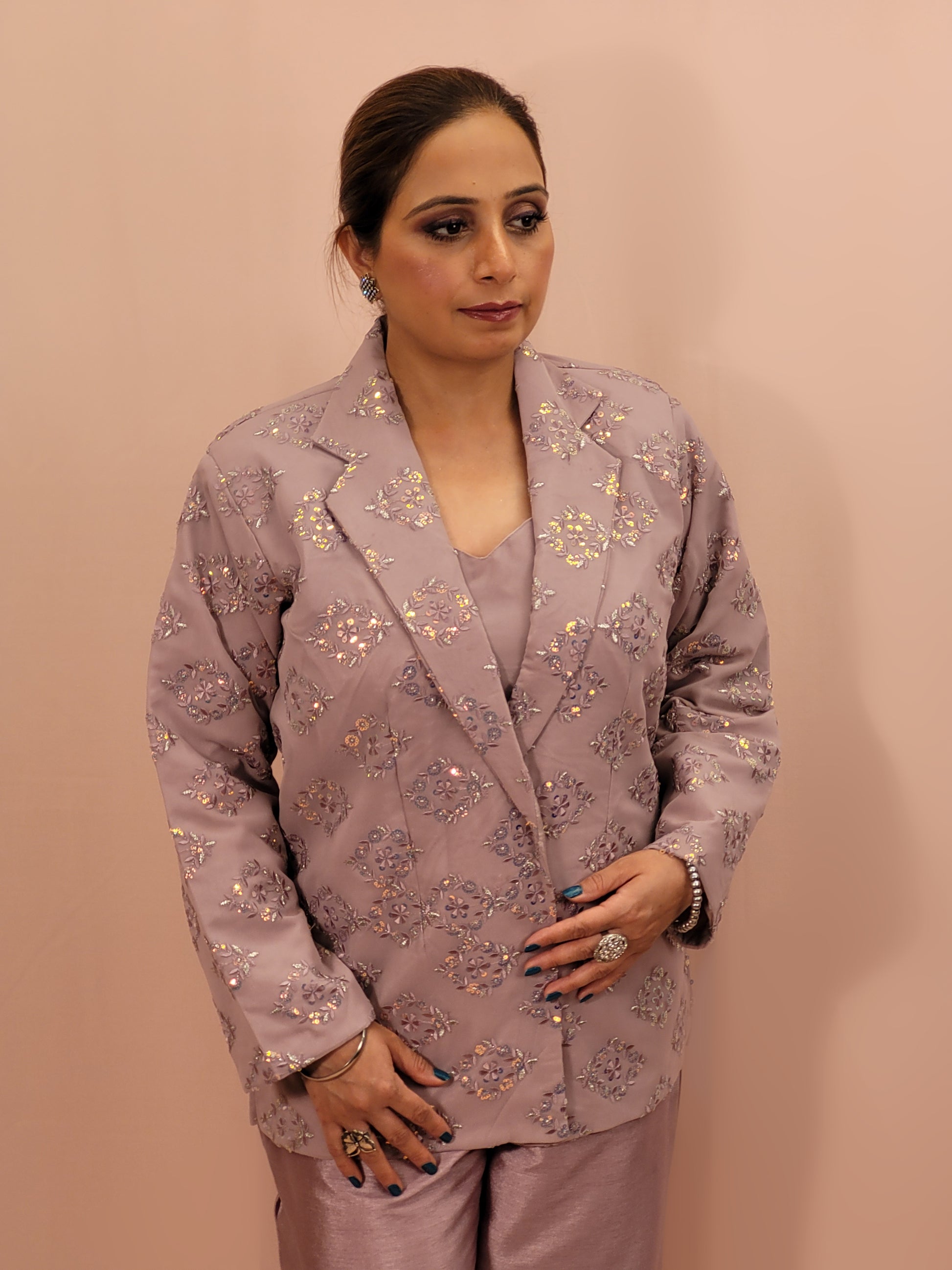 Light Onion Fusion Indo-western Dress.

Contains Silk top and matching Pants.

Matching embroidered Shrug with Resham work and Sequins.

Sophisticated party look.