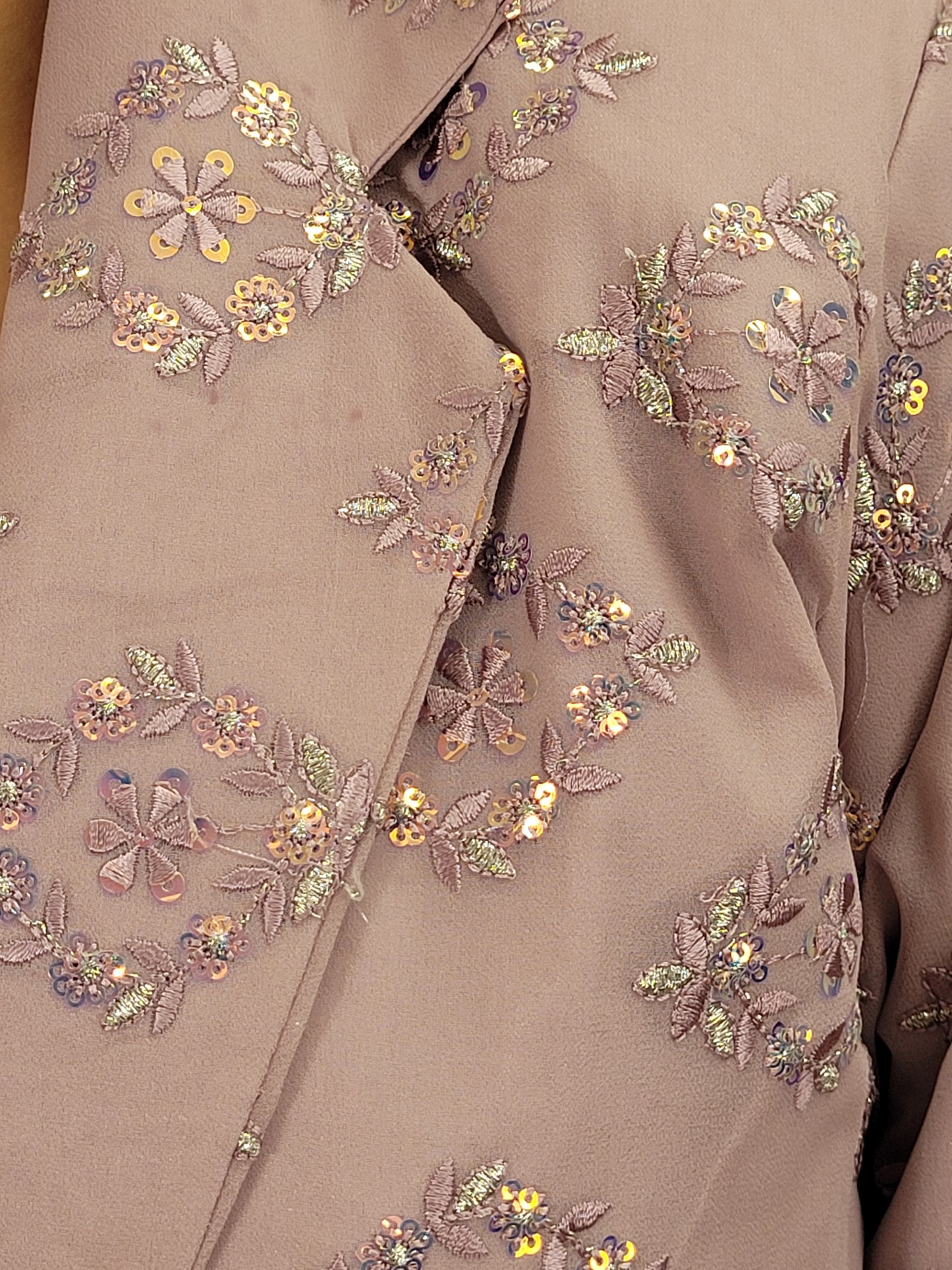 Light Onion Fusion Indo-western Dress.

Contains Silk top and matching Pants.

Matching embroidered Shrug with Resham work and Sequins.

Sophisticated party look.