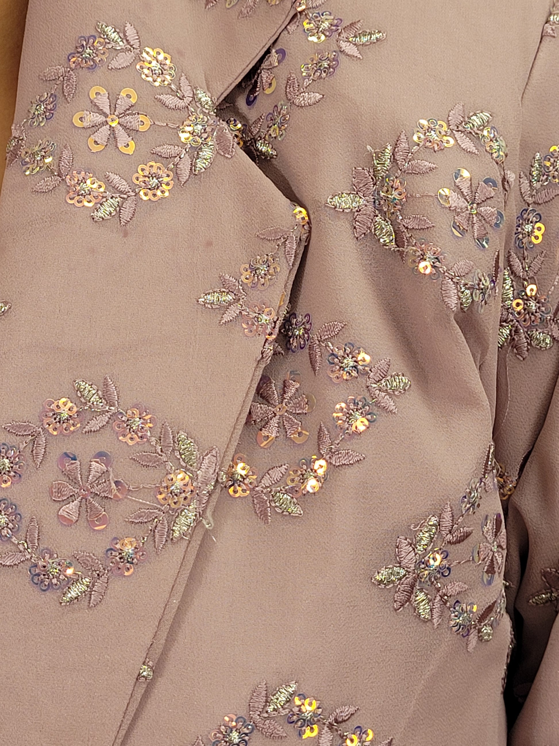 Light Onion Fusion Indo-western Dress.

Contains Silk top and matching Pants.

Matching embroidered Shrug with Resham work and Sequins.

Sophisticated party look.