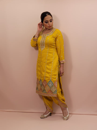 The long-sleeved kameez is paired with a simple yet sophisticated salwar, providing a balanced look that complements the ornate top. Completing the outfit is a matching yellow dupatta, embellished with similar embroidery and beadwork along its borders, adding a graceful touch to your attire.