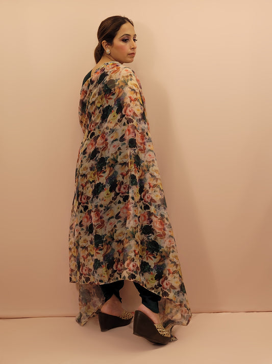 The blouse is adorned with vibrant resham embroidery, creating a tapestry of traditional artistry on a contemporary silhouette. The tulip pants provide a chic and comfortable fit, perfect for modern fashionistas. The digital multicolored print shrug adds a bold statement to the ensemble, with its vibrant hues and unique patterns.