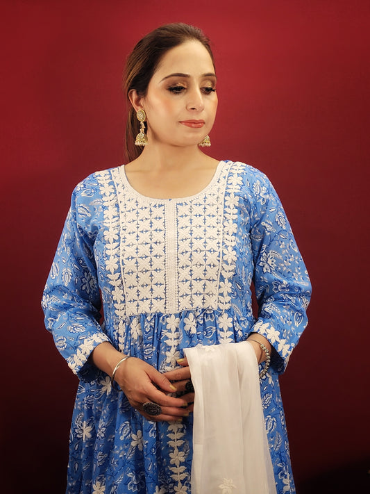 Embrace effortless style with the Floral Chikankari Anarkali Kurti Set, a versatile piece that transitions seamlessly from casual outings to office wear and summer parties. The stunning blue cotton base is adorned with a delicate floral print, further accentuated by intricate chikankari embroidery.