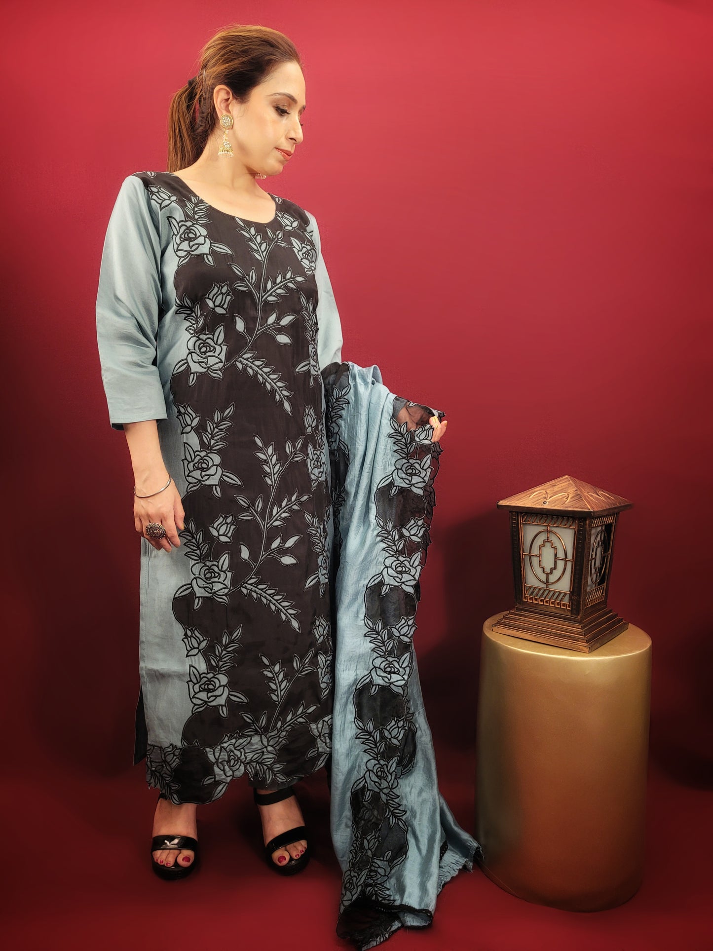 Embrace contemporary elegance with this stunning grey and black kurti pant dupatta set, perfect for light parties and festive soirees. This captivating ensemble features a unique interplay of colors and textures, making a bold statement without compromising on comfort.