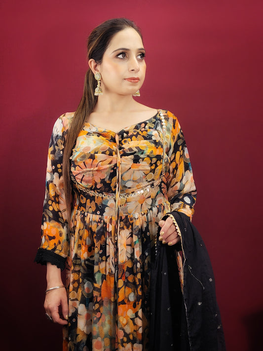 Make a dazzling statement in this stunning Alia Cut Suit Set, perfect for light parties and festive occasions. The vibrant multicolor digital print on a black Georgette base creates a mesmerizing look that will turn heads wherever you go.