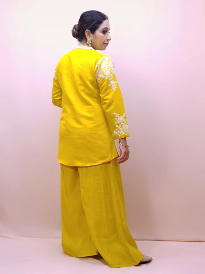 Yellow Indo Western Palazzo Dress. White Resham embroidery on collar, sleeves and daaman. Great choice for Haldi function.
