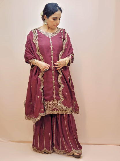 Heavy Embroidered Punjabi Sharara Suit. Zari embroidery on kurti sleeves. Embroidered sharara and dupatta.