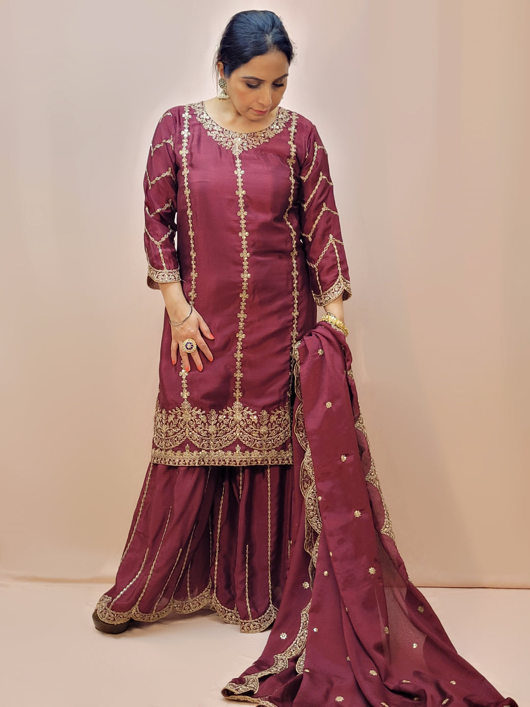 Heavy Embroidered Punjabi Sharara Suit. Zari embroidery on kurti sleeves. Embroidered sharara and dupatta.