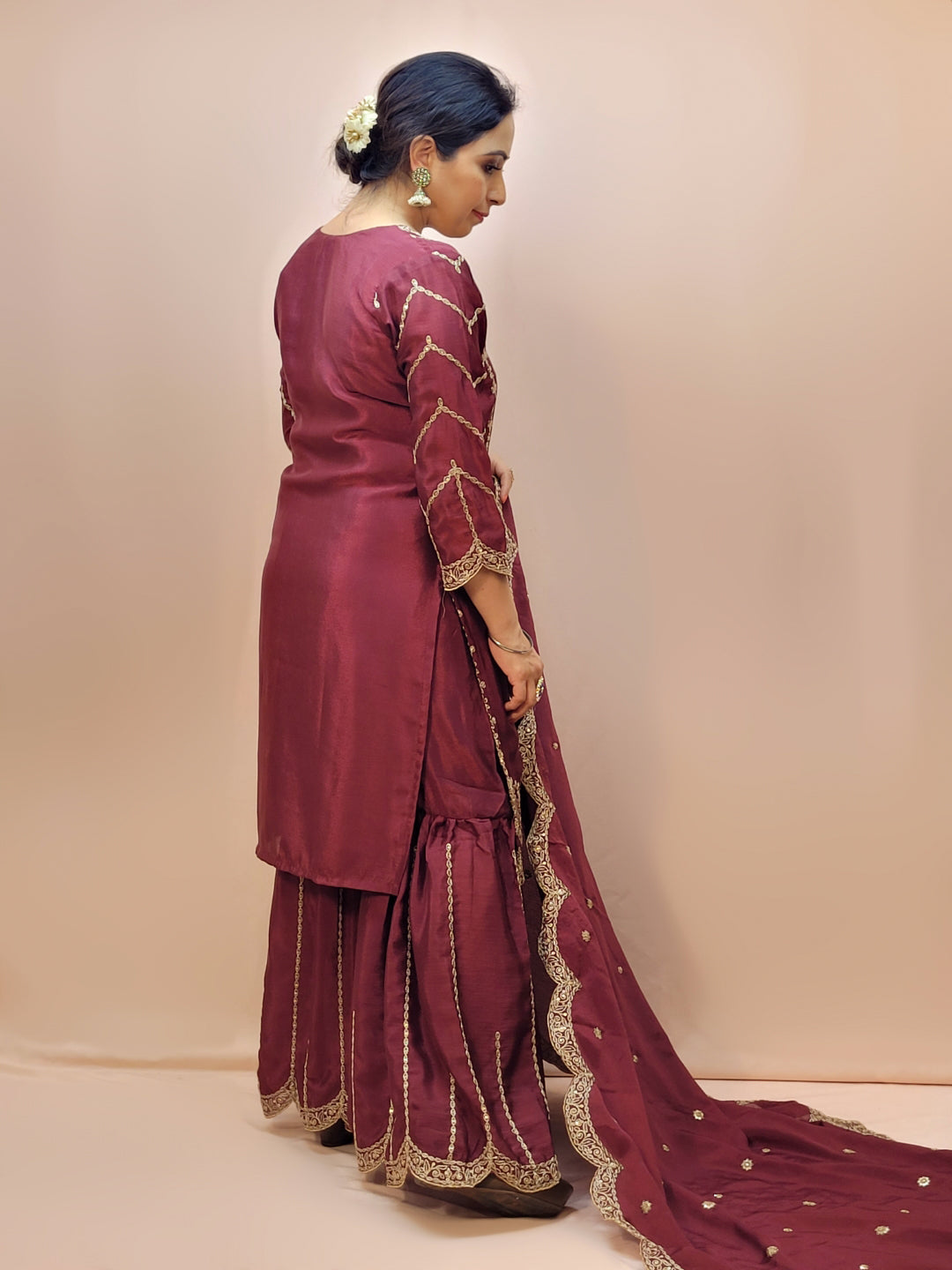 Heavy Embroidered Punjabi Sharara Suit. Zari embroidery on kurti sleeves. Embroidered sharara and dupatta.