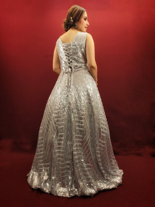 Envision a silver grey bridal gown, in imported fabric and embellished with shimmering sequins, designed to be the center-piece of your wedding, engagement, or reception party.
