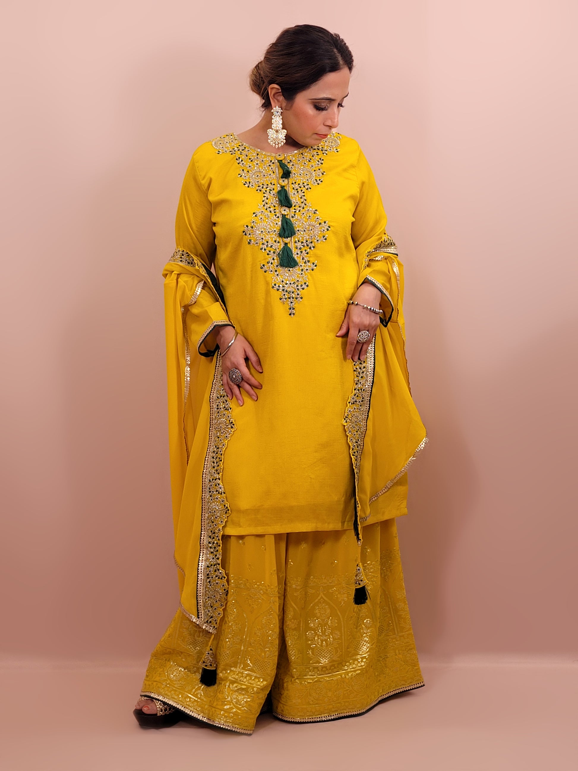 Yellow sharara suit with zari and resham neckline. Bichitra Silk Kameez. Georgette Shrug with Zari and Resham work border. Georgette Sharara wit Schiffli Work.