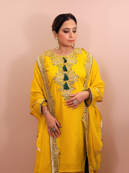 Yellow sharara suit with zari and resham neckline. Bichitra Silk Kameez. Georgette Shrug with Zari and Resham work border. Georgette Sharara wit Schiffli Work.