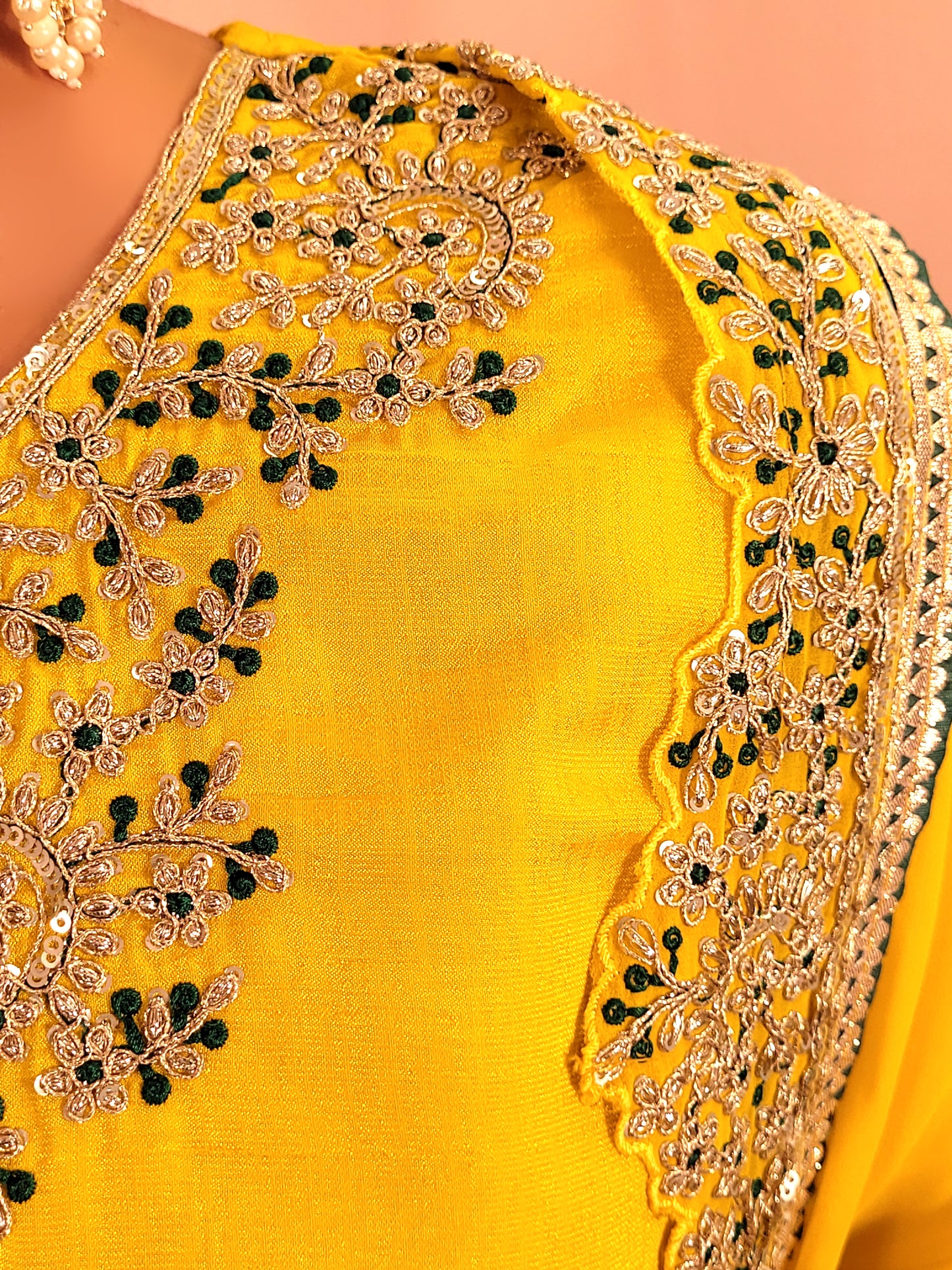 Yellow sharara suit with zari and resham neckline. Bichitra Silk Kameez. Georgette Shrug with Zari and Resham work border. Georgette Sharara wit Schiffli Work.
