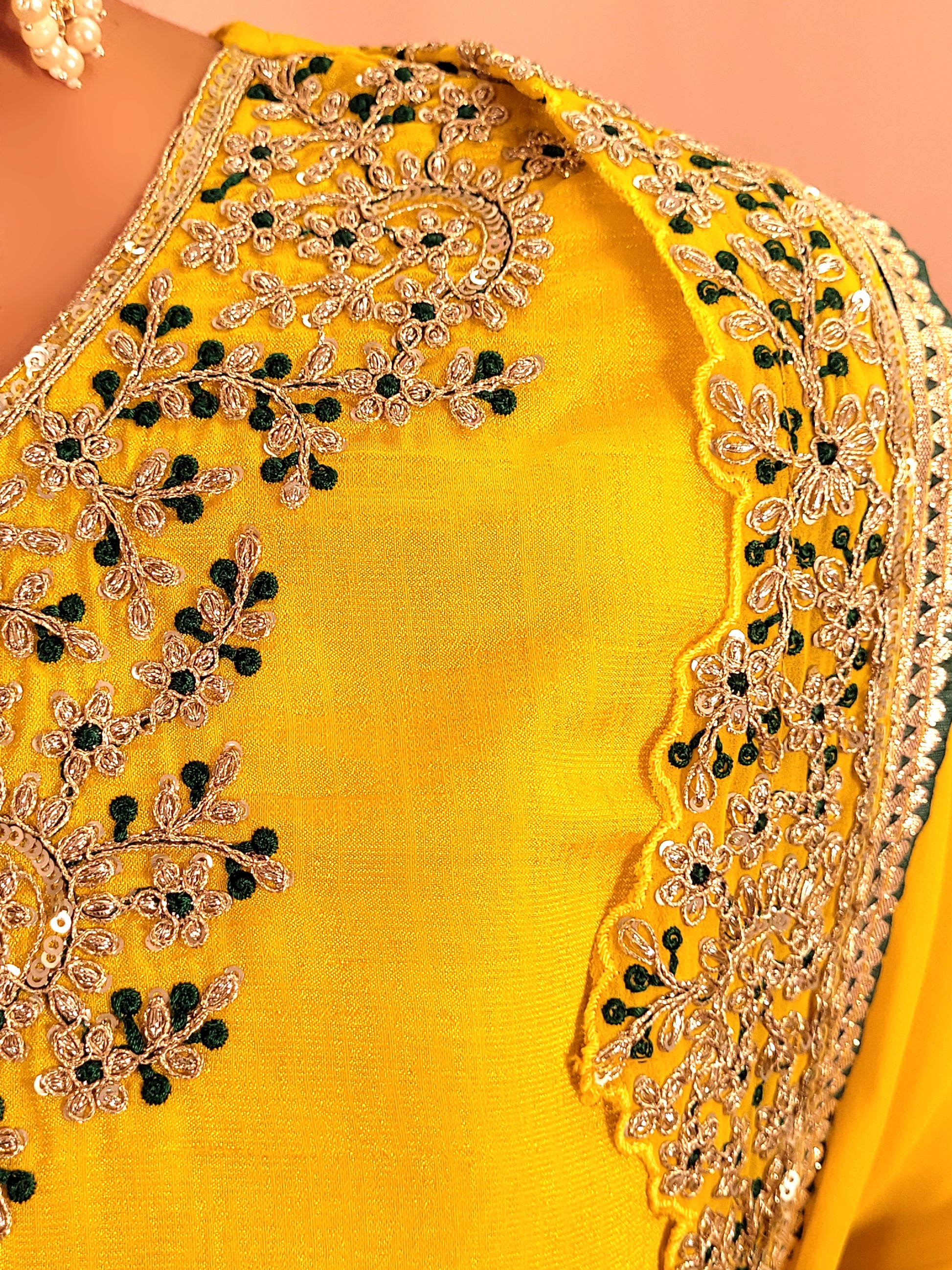 Yellow sharara suit with zari and resham neckline. Bichitra Silk Kameez. Georgette Shrug with Zari and Resham work border. Georgette Sharara wit Schiffli Work.