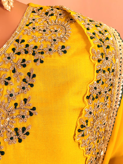 Yellow sharara suit with zari and resham neckline. Bichitra Silk Kameez. Georgette Shrug with Zari and Resham work border. Georgette Sharara wit Schiffli Work.