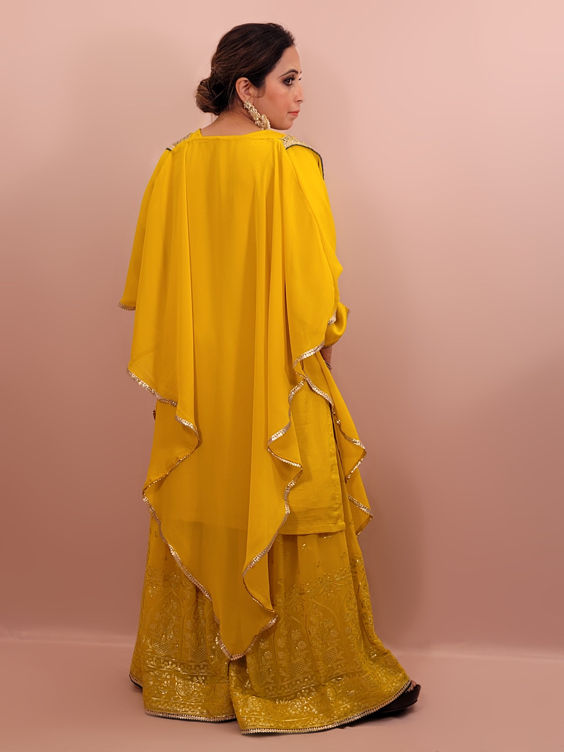 Yellow sharara suit with zari and resham neckline. Bichitra Silk Kameez. Georgette Shrug with Zari and Resham work border. Georgette Sharara wit Schiffli Work.
