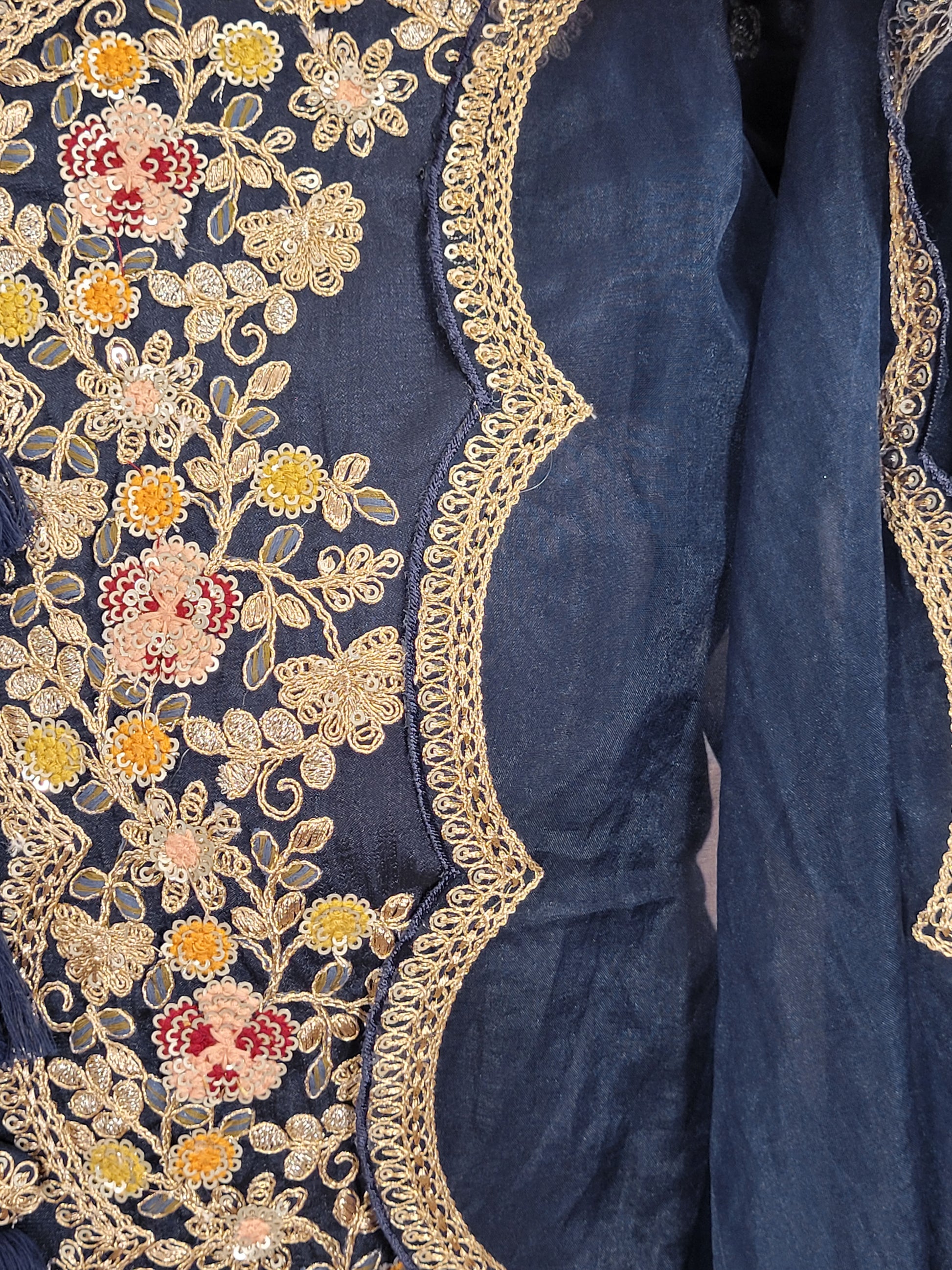 Navy Blue sharara suit with zari, sequins and resham neckline. Bichitra Silk Kameez. Organza Dupatta with Scalloping Border. Georgette Sharara Work.